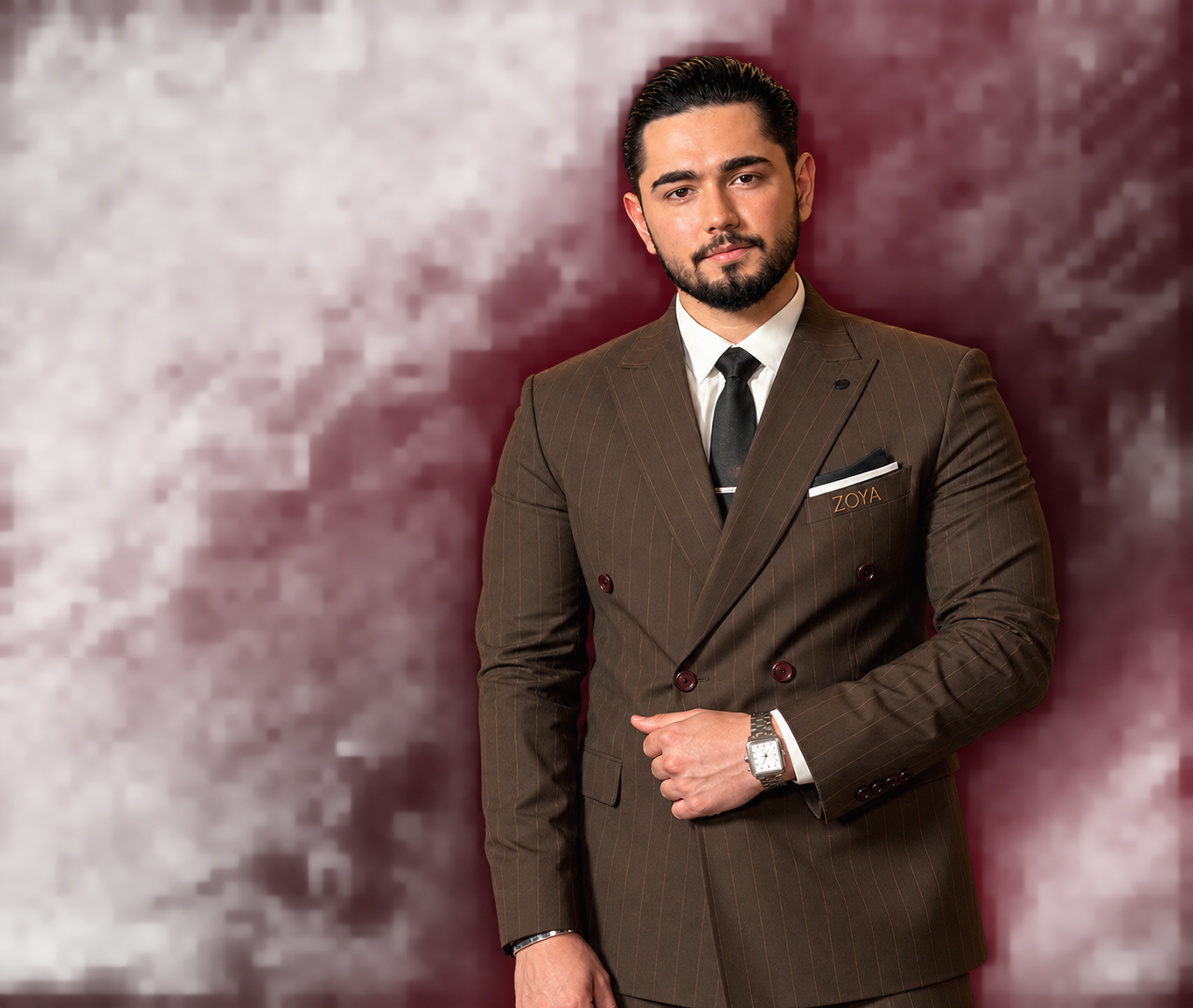 Noor Abdullah in a suit at Zoya Developments